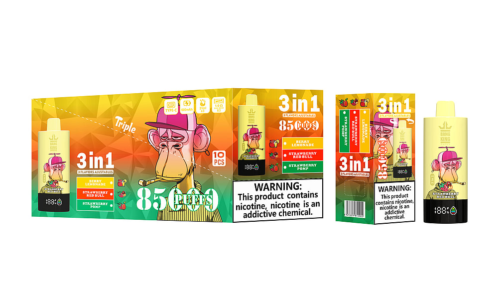 A Colorful Packaging For A Vaping Product Called 'Bang King' Featuring A Cartoon Monkey Wearing A Pink Hat, Showcasing The '3 In 1' Flavor Options: Berry Lemonade, Strawberry Red Bull, And Strawberry Pomp, With A Warning Label About Nicotine Addiction.