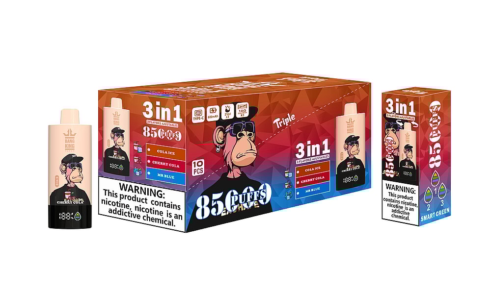 A Colorful Packaging Of A Vape Product Featuring A Cartoon Monkey Character, Labeled &Quot;Bang King&Quot; With Flavors Like Cola Ice, Cherry Cola, And Mr. Blue, Alongside A Warning About Nicotine Addiction.