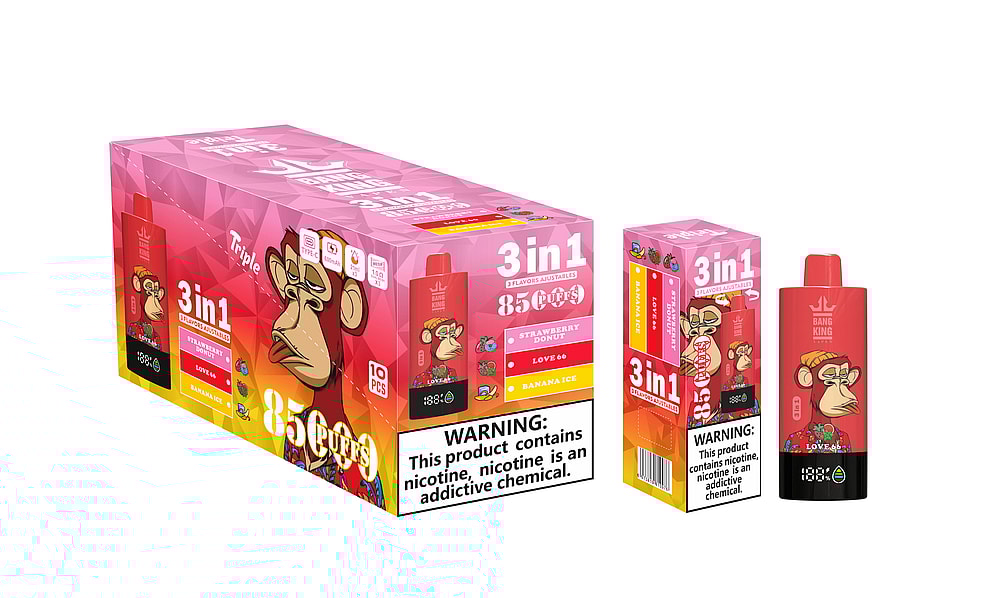 A Colorful Packaging For A Vaping Product Featuring A Cartoon Monkey On The Front, Labeled '3 In 1' With Flavors Of Strawberry Donut, Love 66, And Banana Ice, Designed For 85 Puffs, Alongside Health Warnings About Nicotine Addiction.