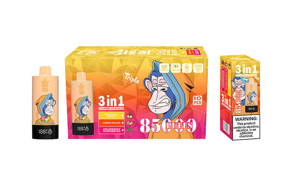 A Colorful Packaging Of A Vaping Product Featuring Three Vape Pens Labeled 'Bang King', Showing Cartoon Monkey Characters, And Highlighting Flavors Of Tropical Fruit, Lemon Peach, And Strawberry Watermelon, With Text Indicating It Contains 85 Puffs And Comes In A Pack Of 10 Pieces.