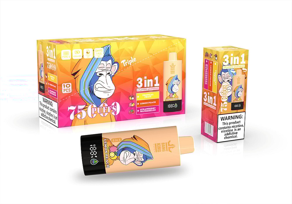 A Colorful Vape Product Packaging Featuring A Cartoon Monkey With A Blue And Orange Hoodie, Displaying The Label &Quot;75 Puffs&Quot; And Stating &Quot;3 In 1&Quot; With Flavors Including Lemon Peach, Tropical Fruit, And Strawberry Watermelon, Alongside A Warning About Nicotine.