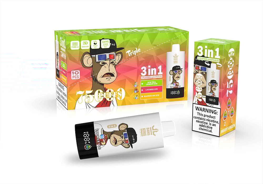 A Box Of Vape Products Featuring A Cartoon Monkey Character, Labeled '3 In 1' With Flavors Including Iced Tea Lemon Ice, Lychee Ice, And Mango On Ice, Alongside A Vape Device Displaying Battery Status And The Brand Logo.