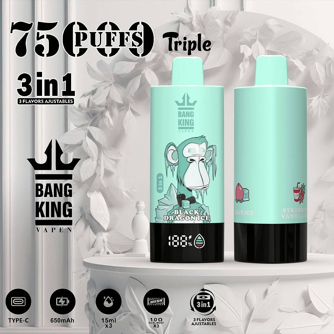 A Close-Up Of A Teal Vape Device Labeled 'Bang King' Featuring Three Flavors: 'Black Dragon Ice,' 'Peach Ice,' And 'Strawberry Vanilla,' Displayed On A White Pedestal Surrounded By Decorative Foliage, With Visible Battery Percentage At 188% And Type-C Charging Port.