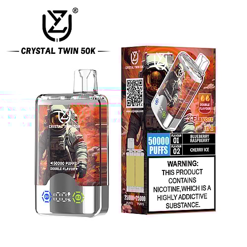 A Crystal Twin 50K vape device featuring an astronaut design, labeled for 50,000 puffs with dual flavors of Blueberry Raspberry and Cherry Ice, displayed alongside a warning about nicotine addiction.