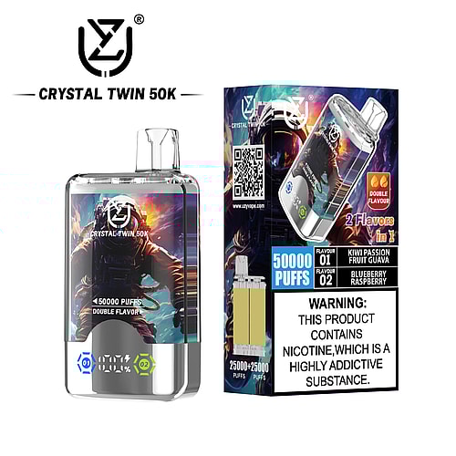 A Crystal Twin 50K disposable vape device with a transparent body displaying an astronaut graphic, information about its capacity of 50,000 puffs, and flavor options of Kiwi Passion Fruit Guava and Blueberry Raspberry, alongside a warning about nicotine addiction.