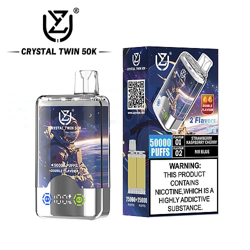 A clear vaporizer labeled 'CRYSTAL TWIN 50K', featuring a futuristic design with a digital display, next to its colorful packaging that indicates it contains two flavors: Strawberry Raspberry Cherry and Mr. Blue, with a warning about nicotine addiction.