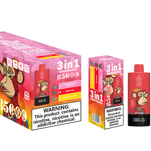 A Colorful Packaging For A Vaping Product Featuring A Cartoon Monkey On The Front, Labeled '3 In 1' With Flavors Of Strawberry Donut, Love 66, And Banana Ice, Designed For 85 Puffs, Alongside Health Warnings About Nicotine Addiction.