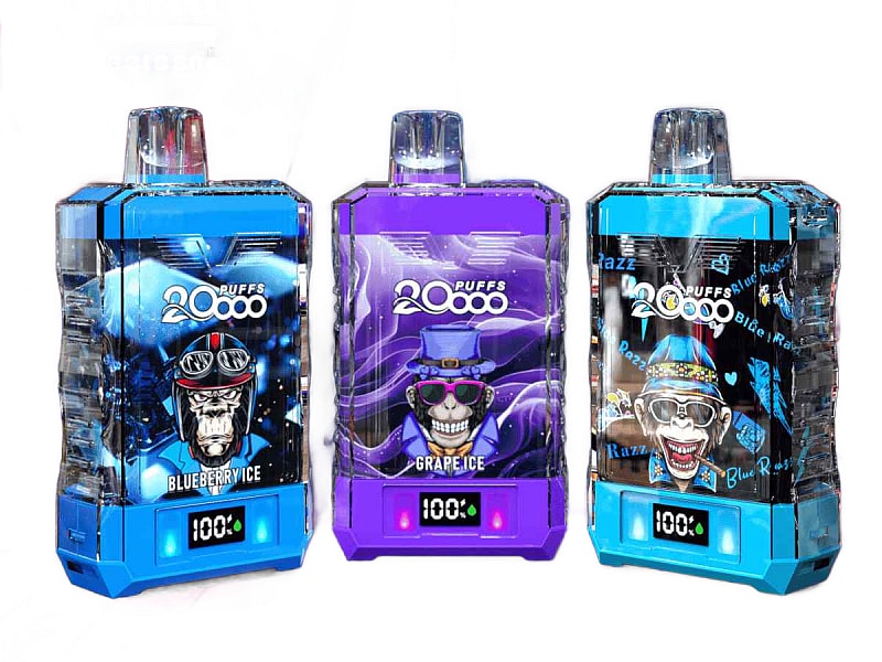 Three colorful disposable vape devices with digital puff counters, labeled "20,000 puffs," featuring designs of skulls wearing hats and goggles, and flavors like Blueberry Ice and Grape Ice.